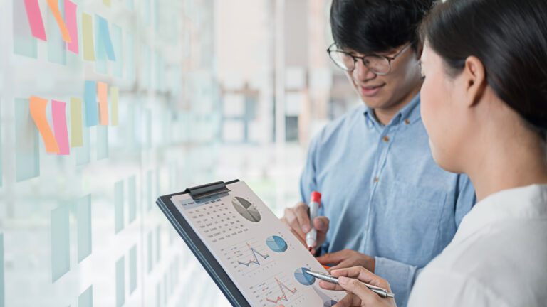A man and a woman engaged in conversation, exchanging thoughts and insights.